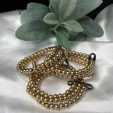 Triple strand gold bracelets w/ black pen