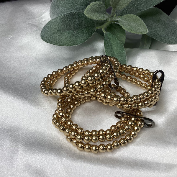 Triple strand gold bracelets w/ black pen