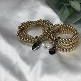 Four gold strand Bracelets w/pearls and hearts