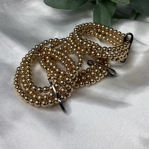 Triple strand gold bracelets w/ black pen